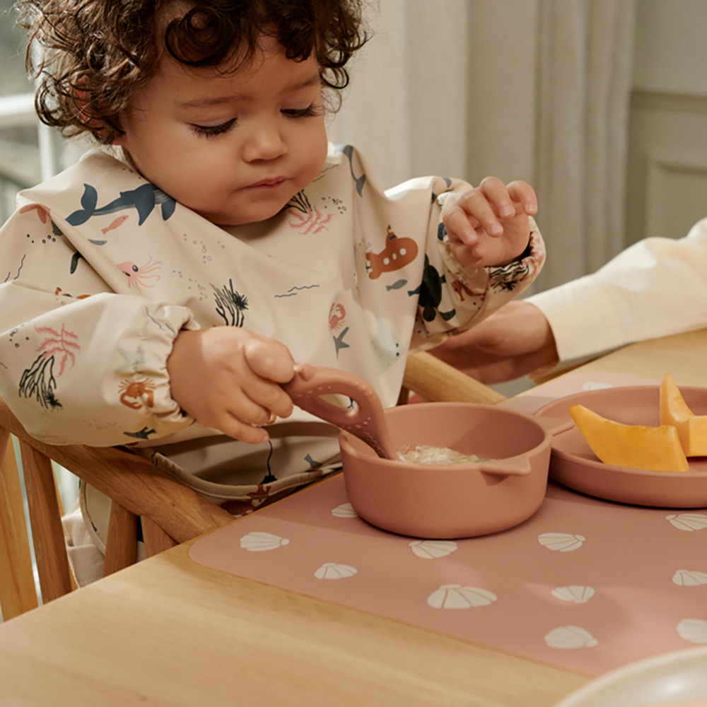 Liewood Merle Printed haklapp med ärm Sea creature / Sandy