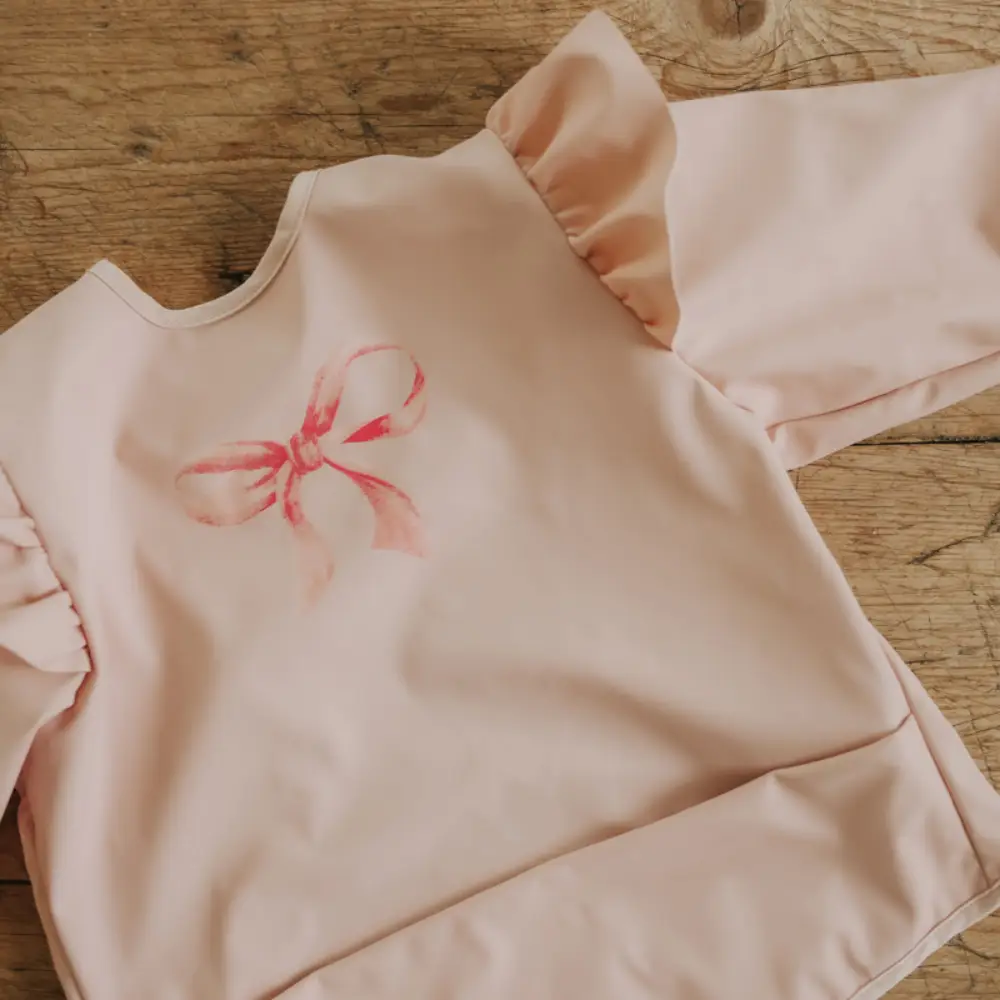 Elodie Longsleeved Baby Bib Rosy Bow One size